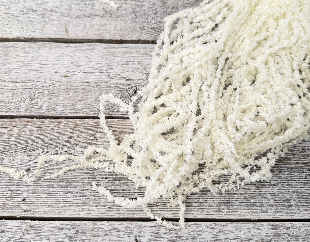 Bleached preserved amaranthus with cascading textured strands for trailing bouquet designs