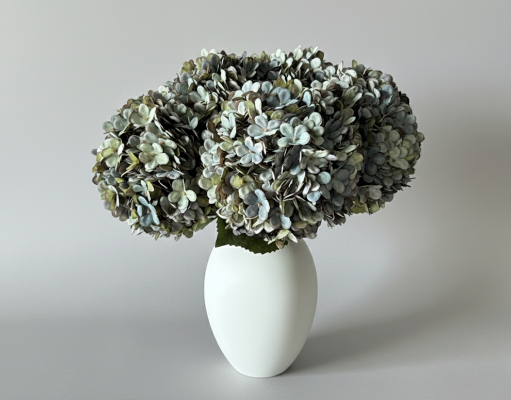 Matte white iron vase for faux tulip and hydrangea arrangements