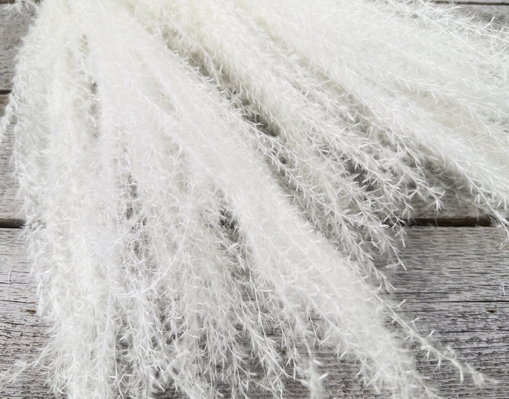 Bleached preserved reed grass with fine airy stems for height and movement in arrangements
